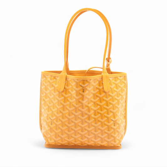 Yellow textured handbag on a white background