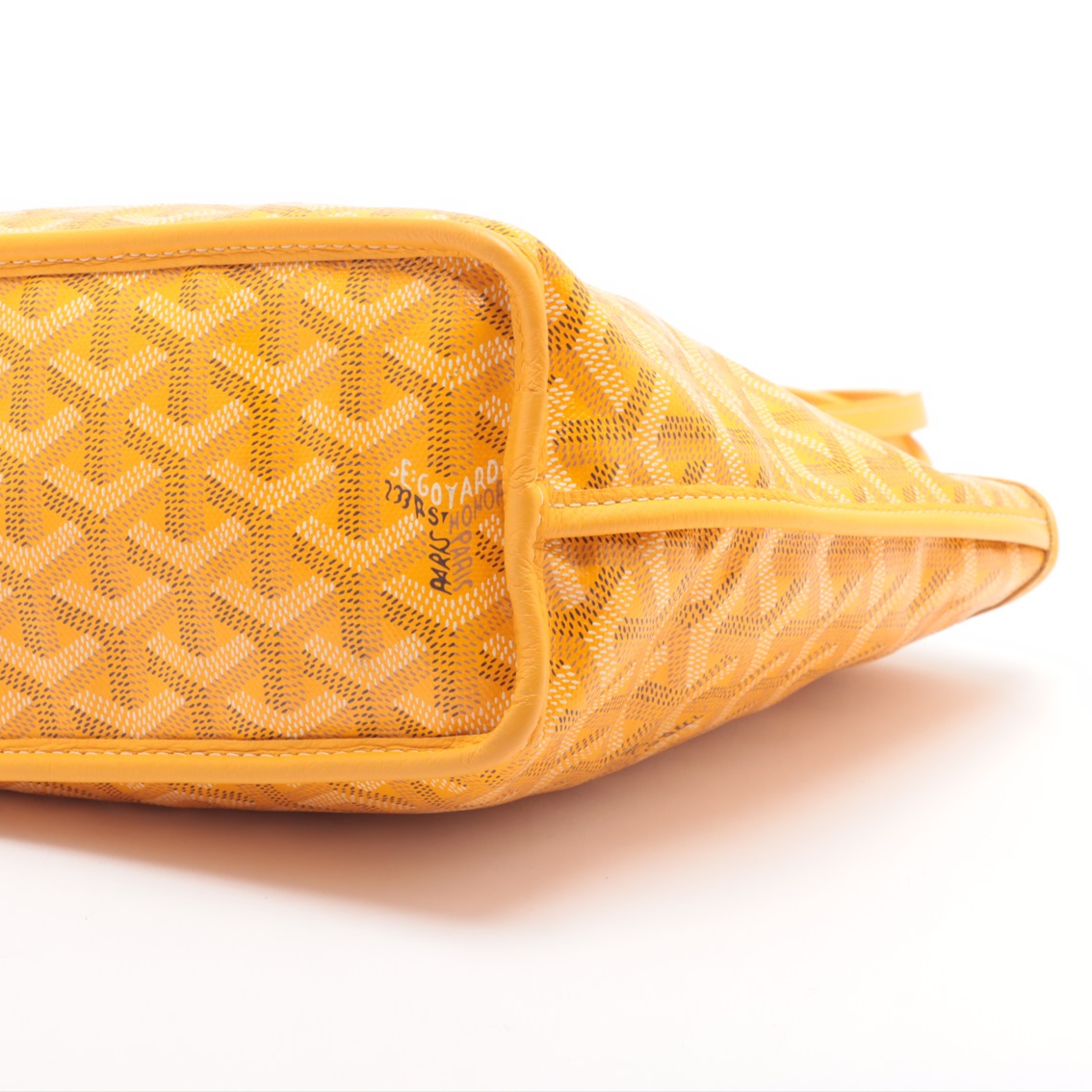Yellow woven handbag on a white background