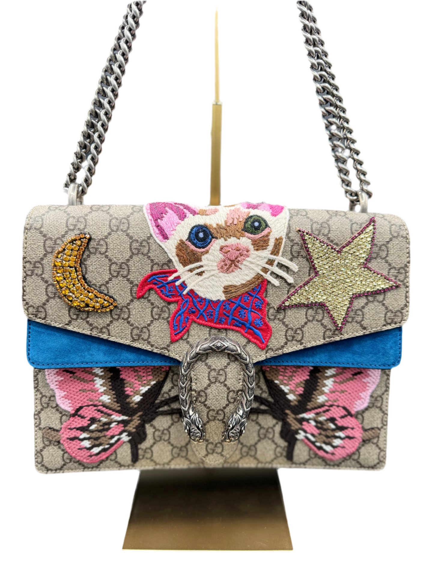 Gucci Dionysus handbag with a colorful suede interior and a multicolored design featuring a cat, moon, and star on the front.