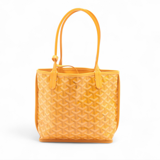 Yellow textured handbag on a white background